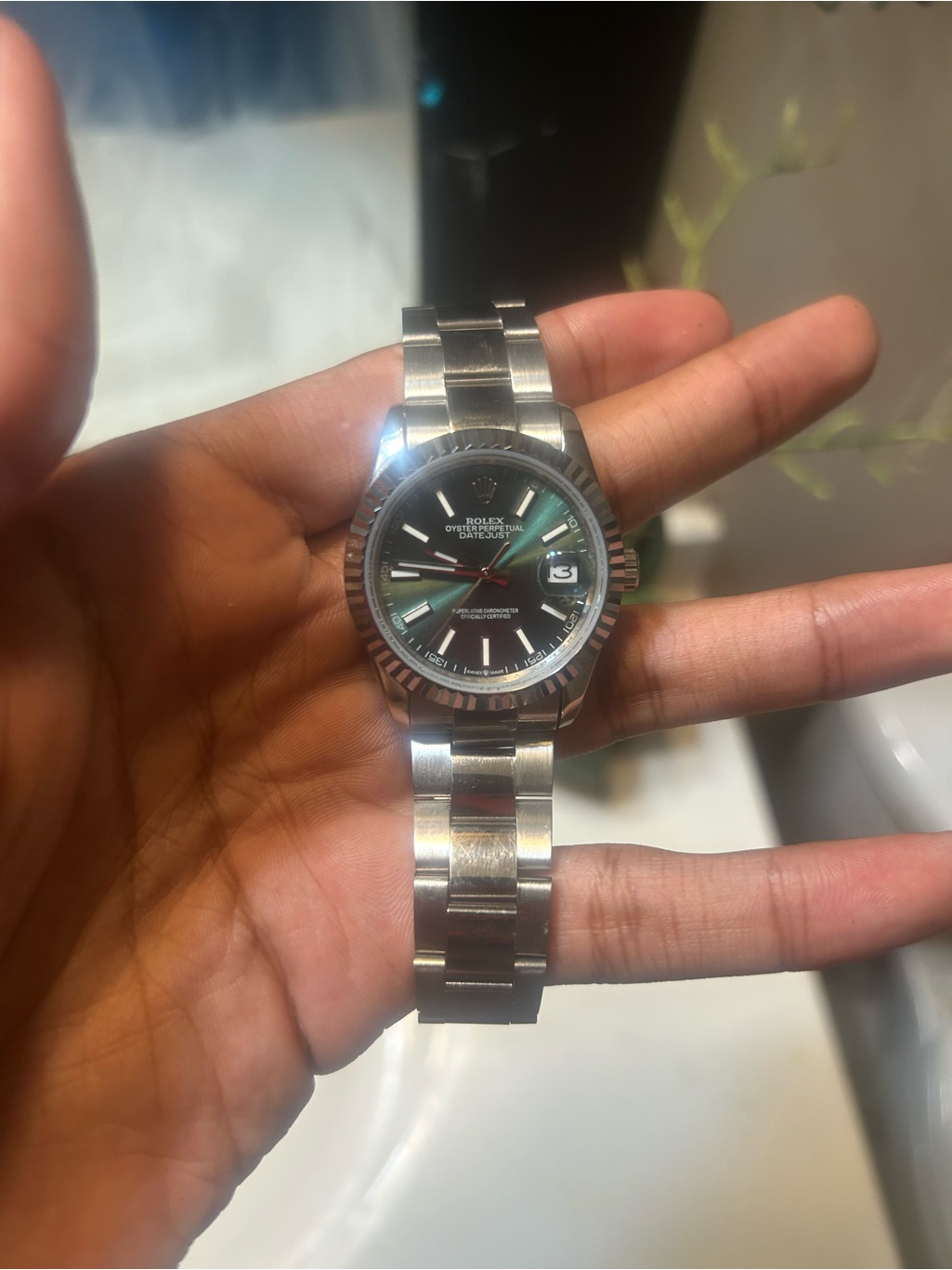 Rolex Stainless Steel Watch With Black Dial And Silver Bracelet